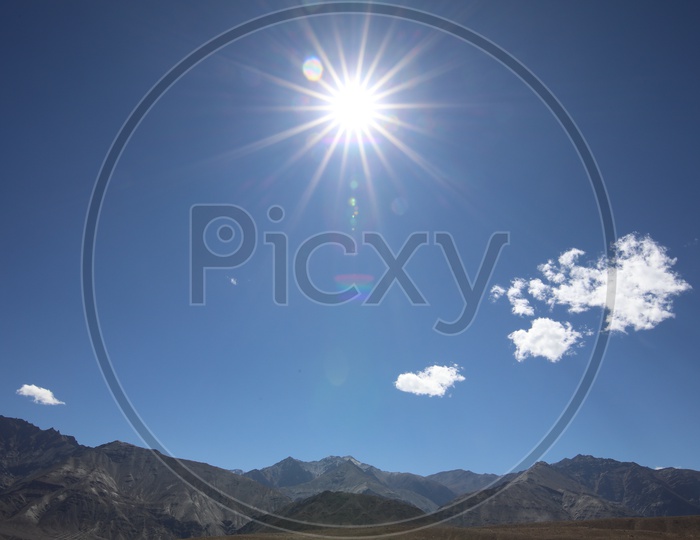 Beautiful Landscape of Snow Capped Mountains of Leh with Sun star in the sky