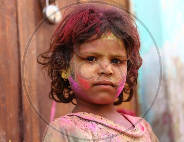 Boy with Colors on face - Holi Celebrations - Indian Festival - Colors/Colorful at Nandagaon