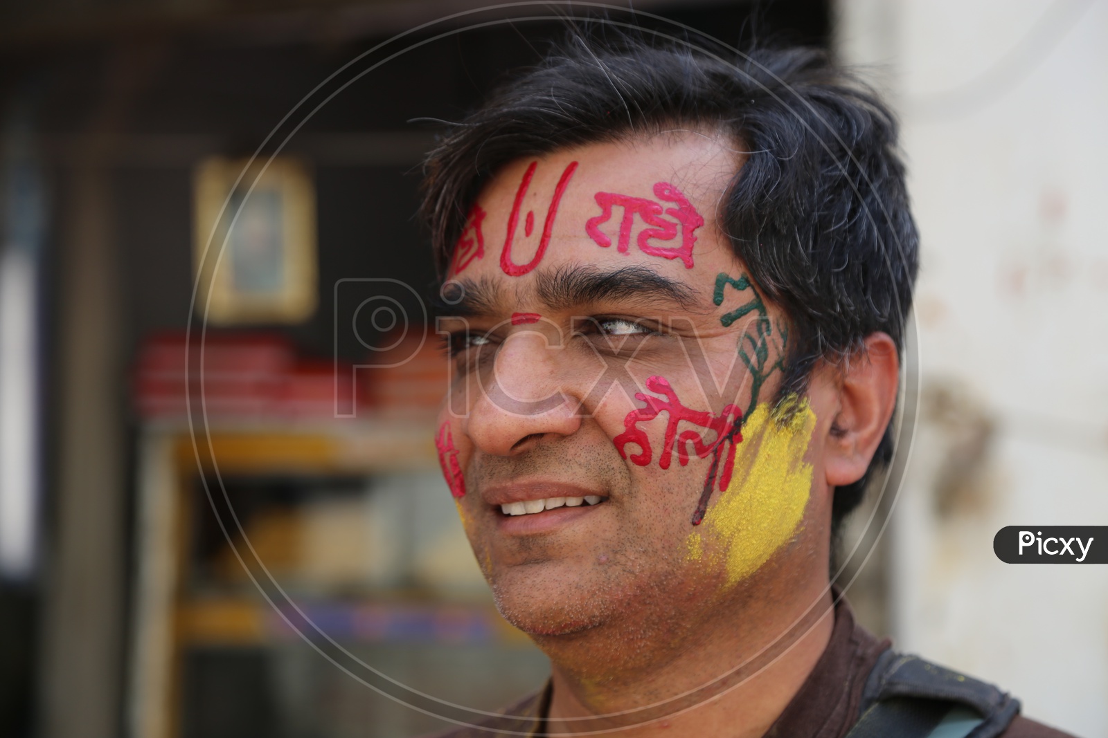 A Local Man In Nandagon With Paint On his Face