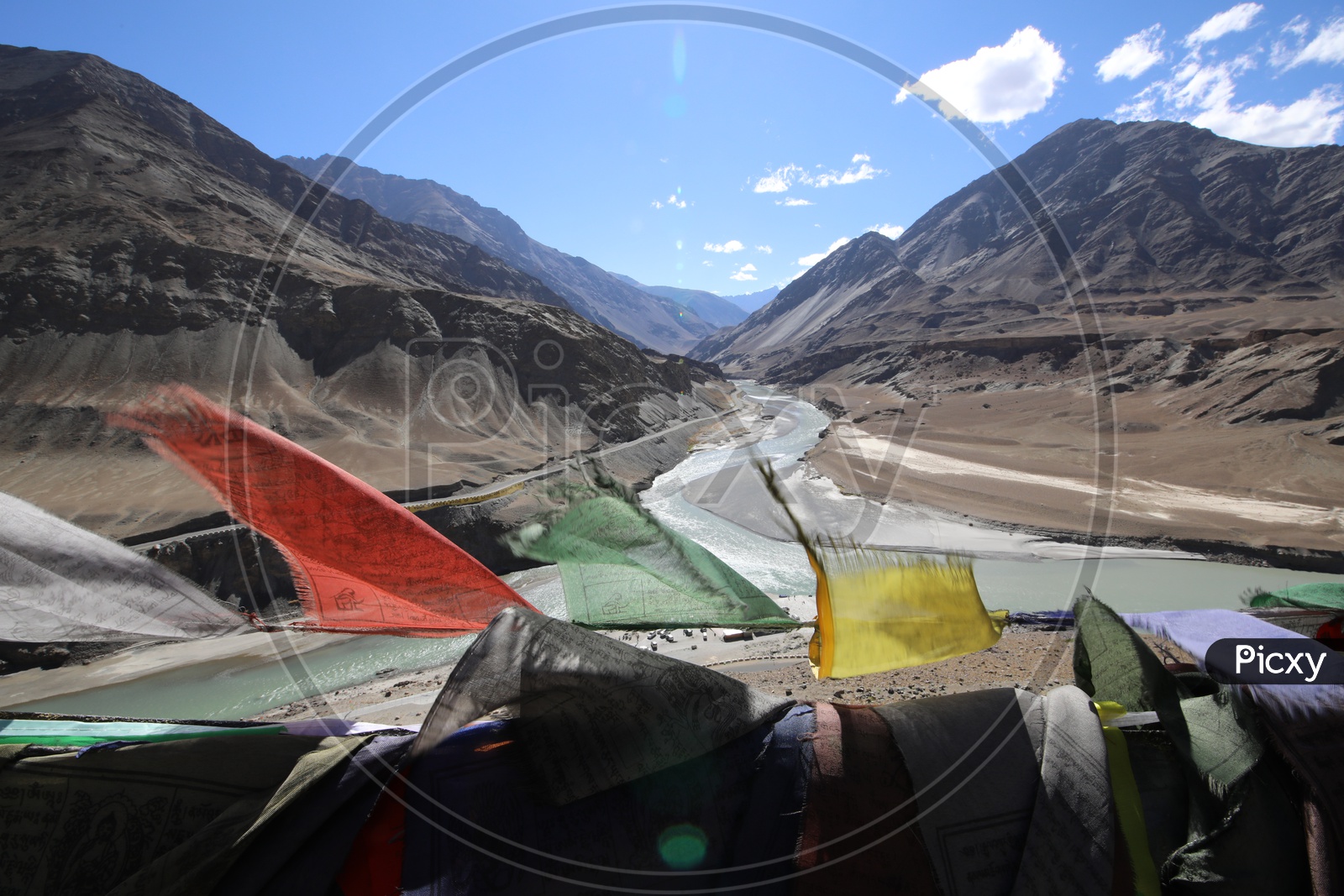 colourful lags with snow capped mountains of leh in background