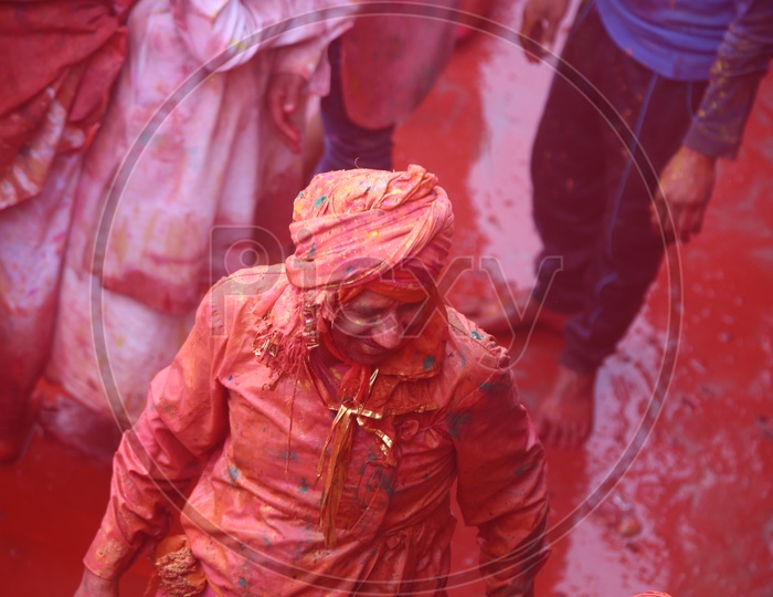 People Celebrating Holi Festival in Nandgaon