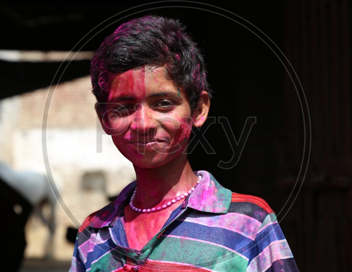 Boy with Colors on his face - Holi Celebrations - Indian Festival - Colors/Colorful at Nandagaon