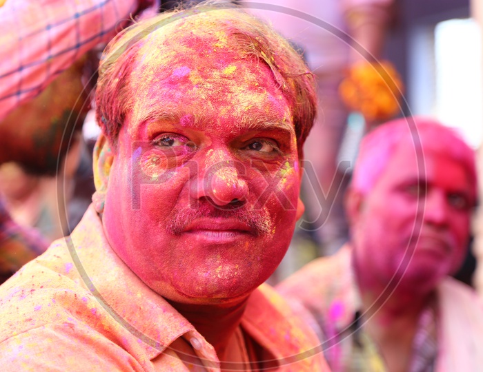 Man with colors on his face - Holi Celebrations - Indian Festival - Colors/Colorful at Nandagaon