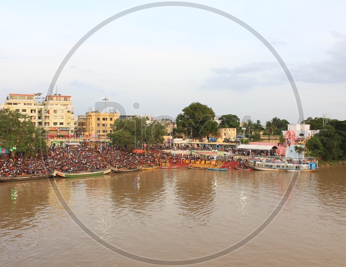 A Beautiful Aerial View Of Rajahmundry Ghat With Pilgrims On The River Bank of Godavari