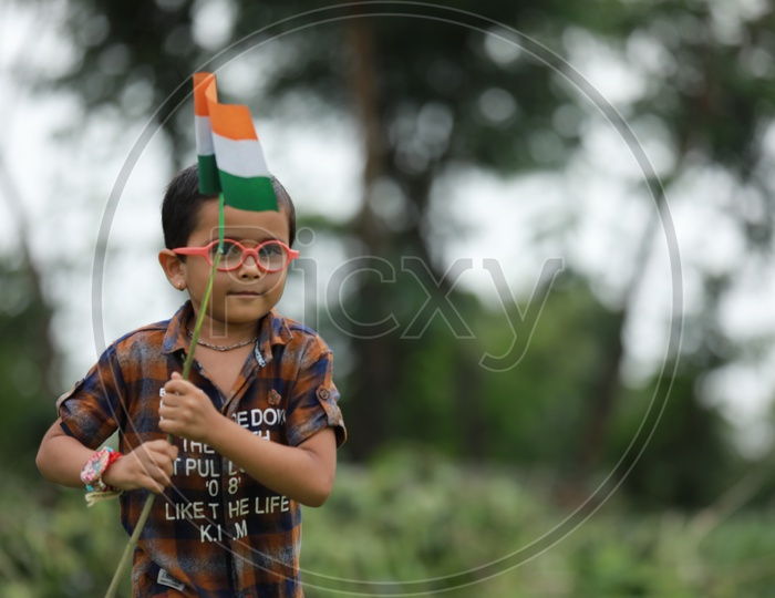 cute little kid having indian flag in hand