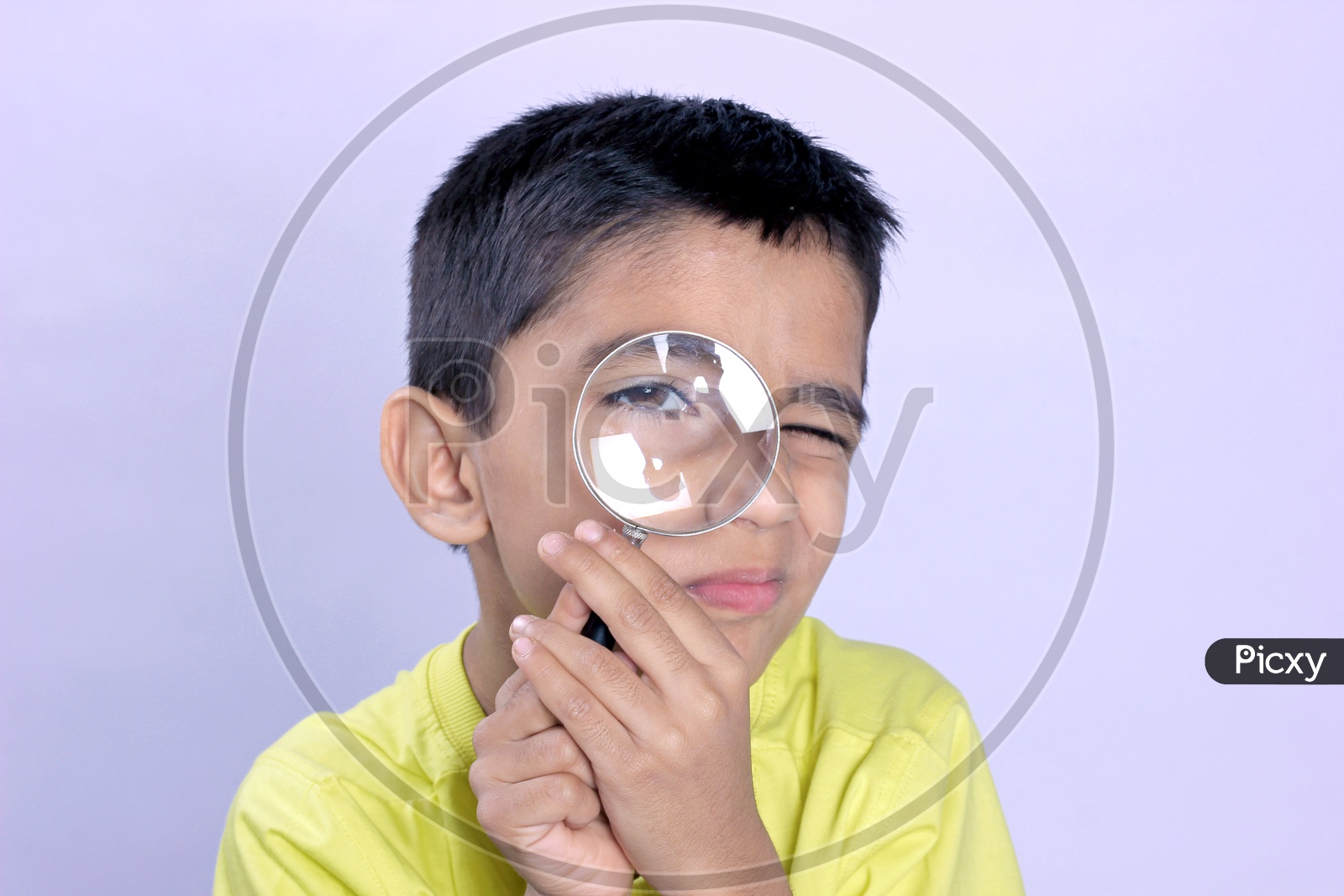 Indian Child Holding Magnifying Glass