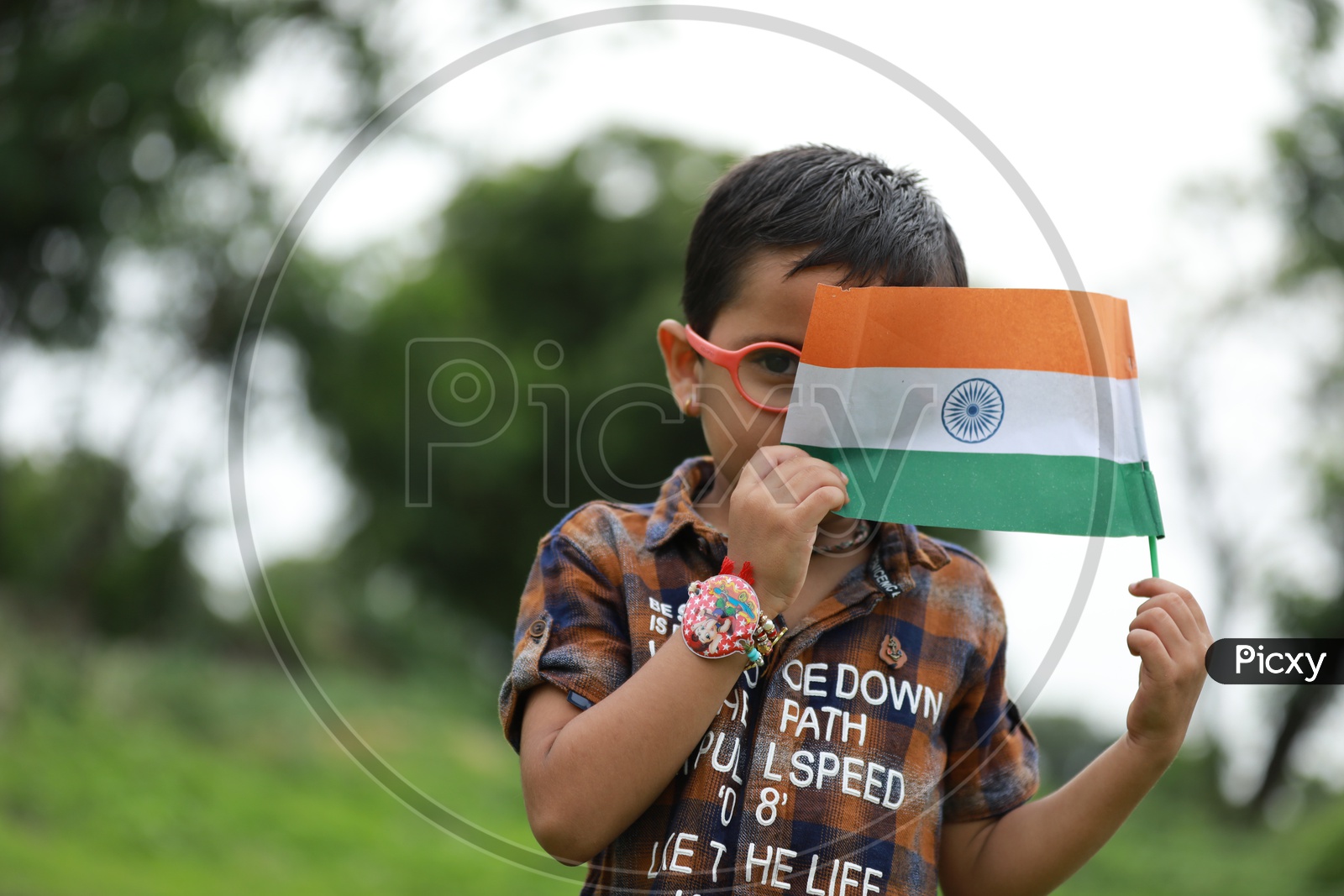 cute little kid having indian flag in hand  / kids portrait