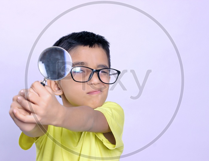 Indian Child on Eyeglass Holding Magnifying Glass