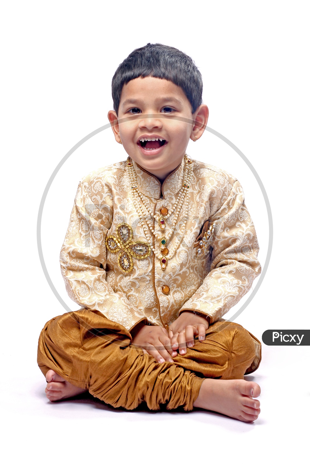 Indian Boy dressed up with ethnic/Kurta pajama/Gold & brown Color