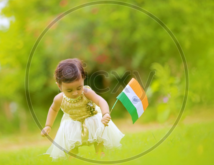 cute little kid having indian flag in hands  / indian flag / nation india