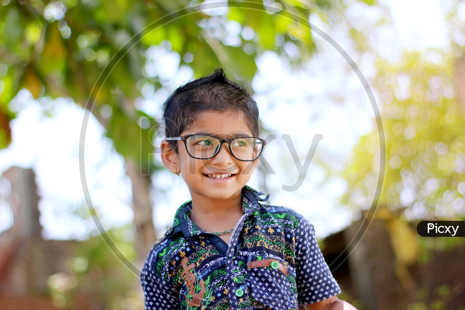 Smiling Indian Child on Eyeglass