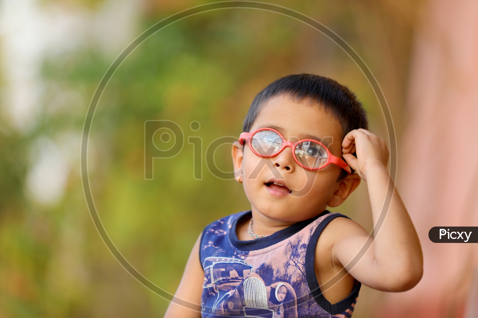 Indian Child with spectacles thinking..