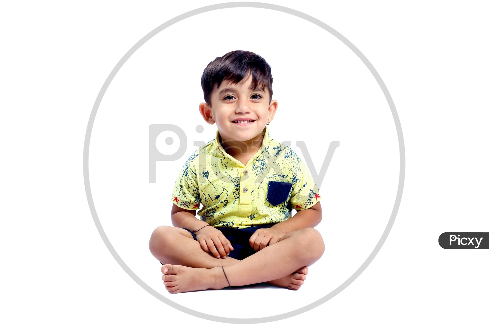 cute little kid with happy face , facing towards the camera