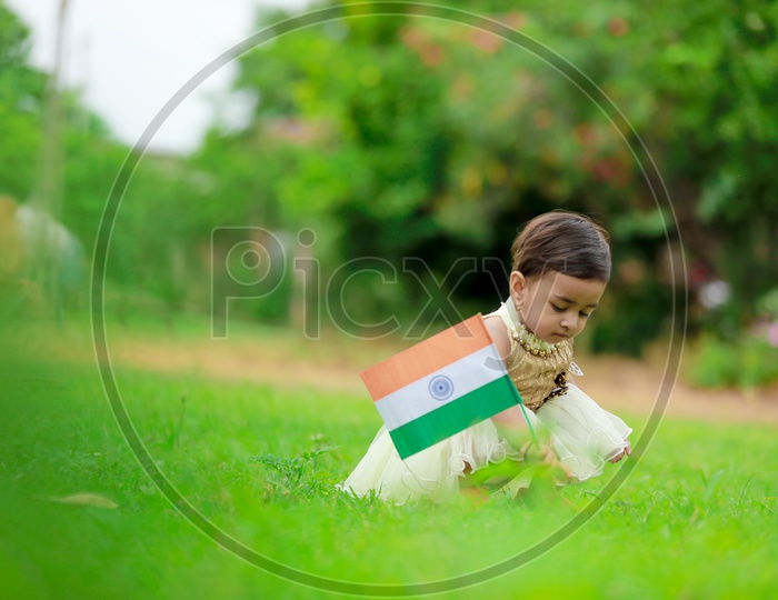 cute little kid having indian flag in hands  / indian flag / nation india