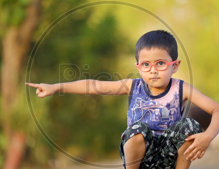 Indian Child on Eyeglass showing Hand