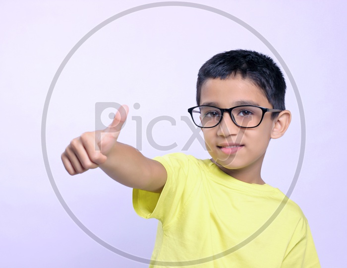 Indian Child on Eyeglass showing Thump up