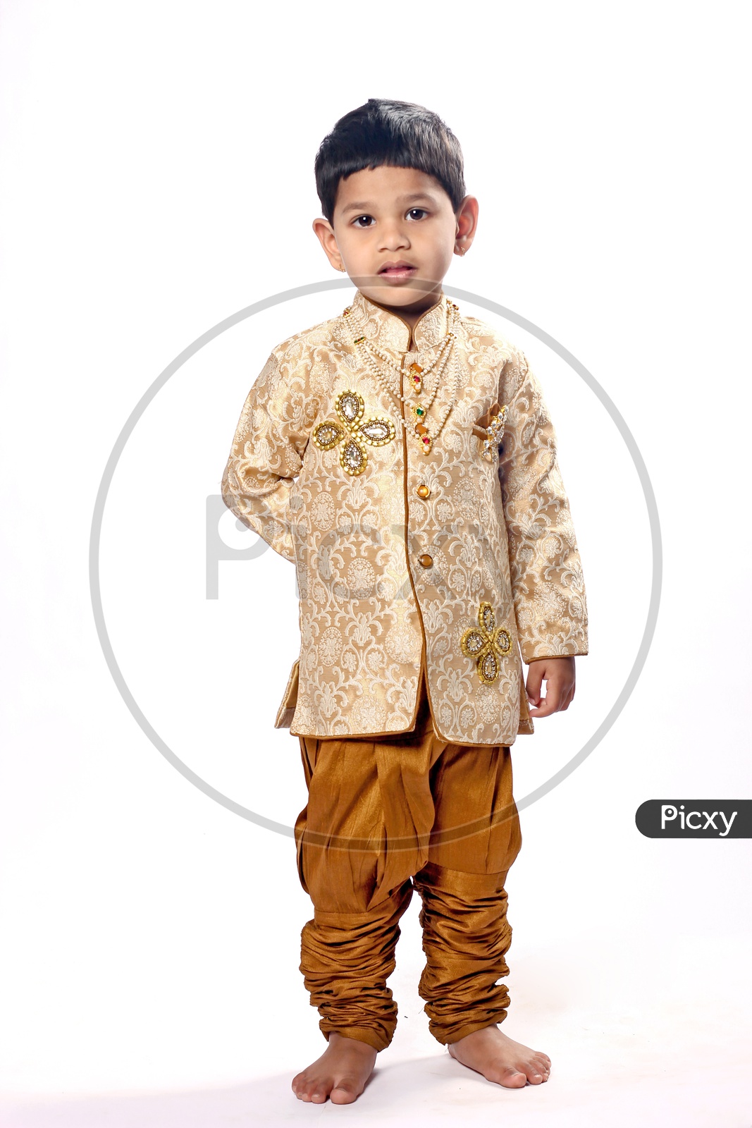 Indian Boy dressed up with ethnic/Kurta pajama/Gold & brown Color