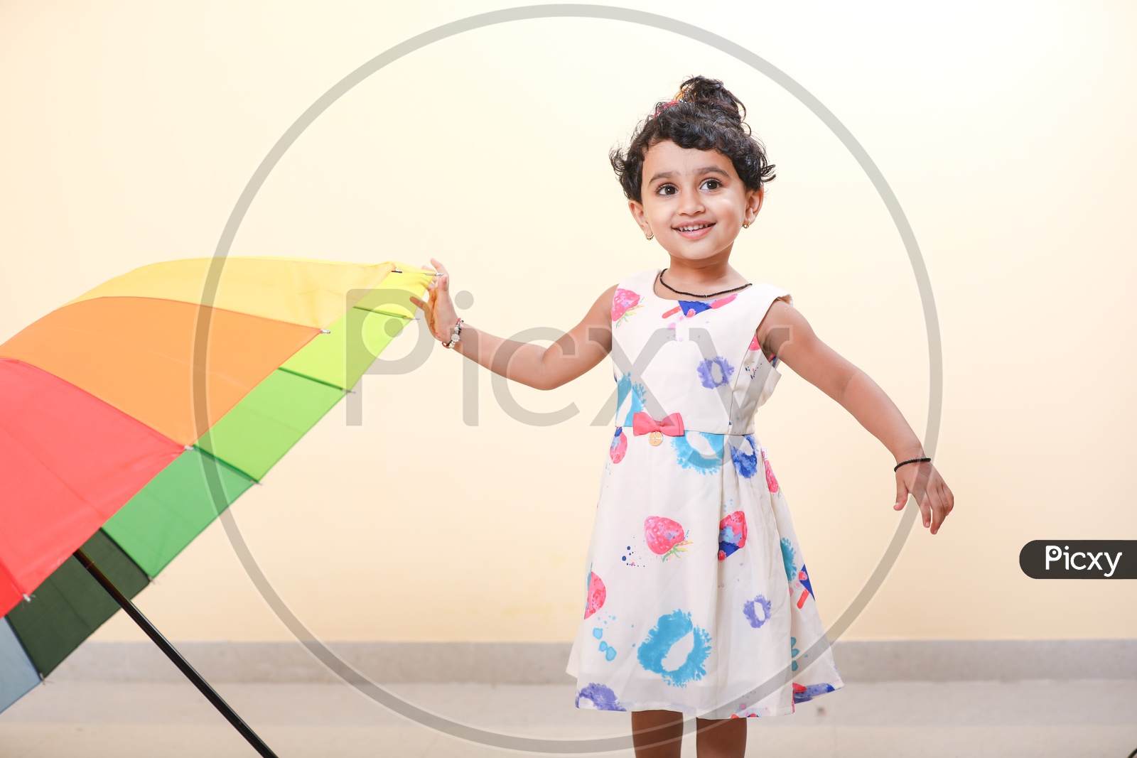 Indian Girl Child with Umbrella and smiling face