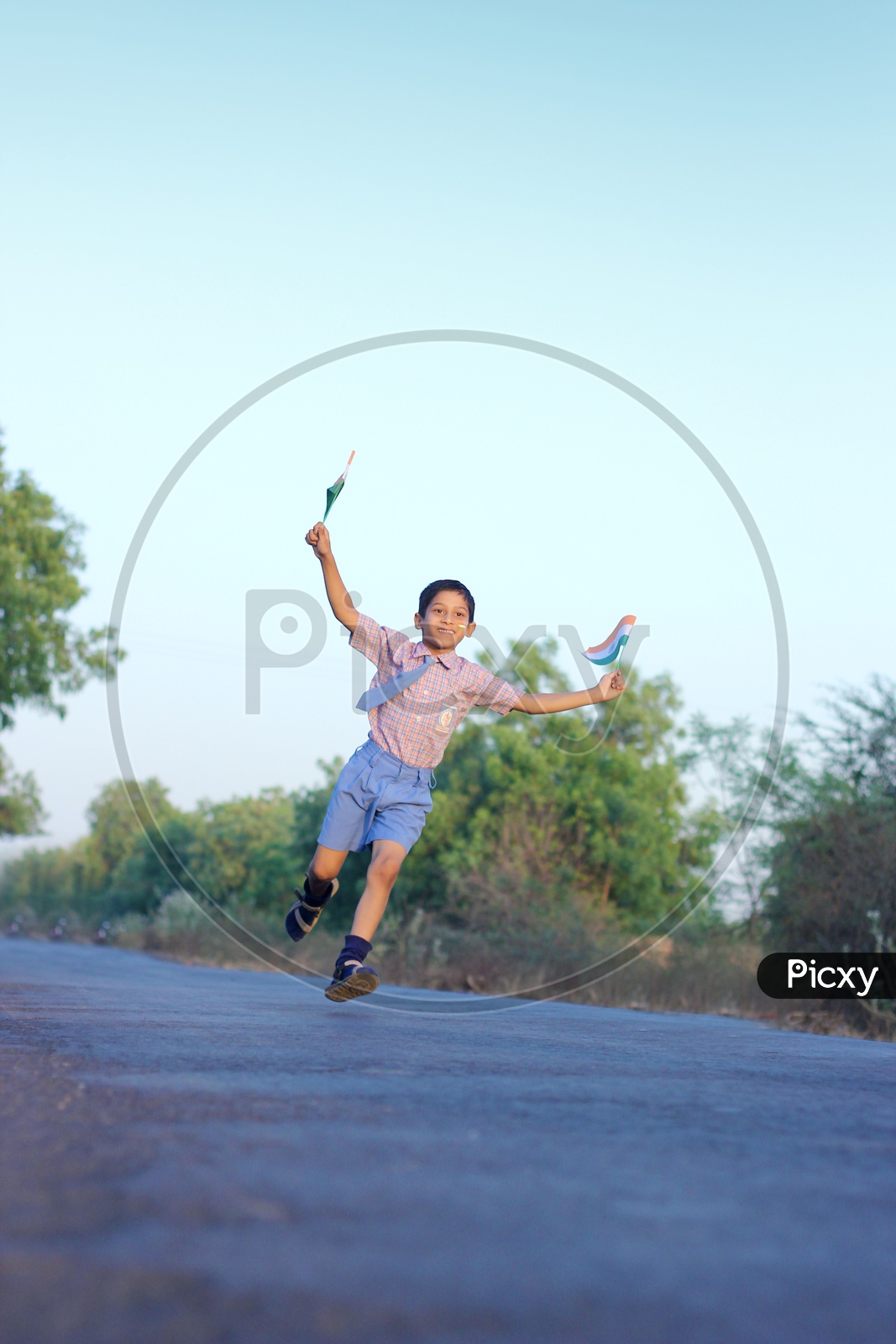 Indian Child running with Indian Flags in Hand