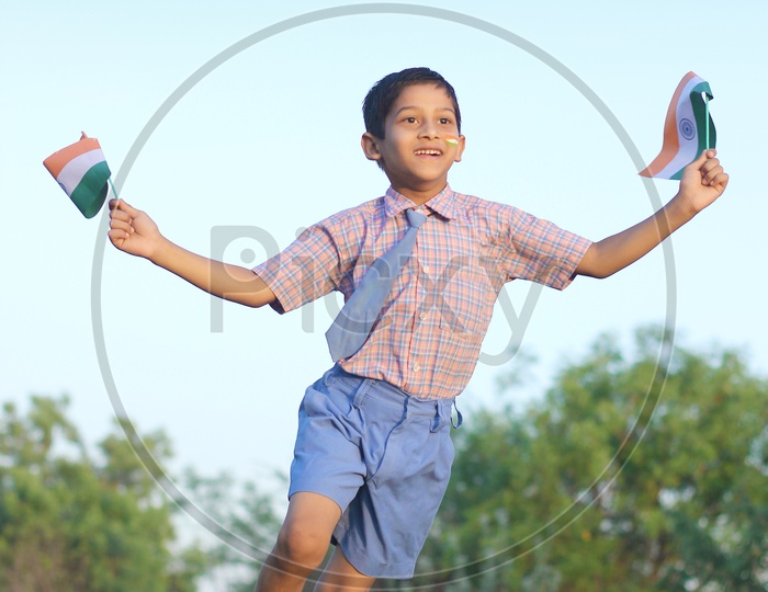 Indian Child running with Indian Flags in Hand
