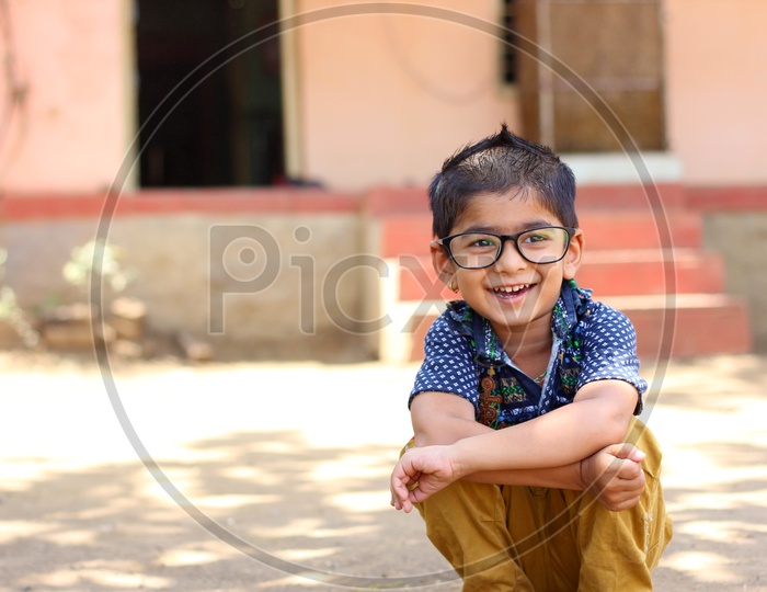 Smiling Indian Child on Eyeglass