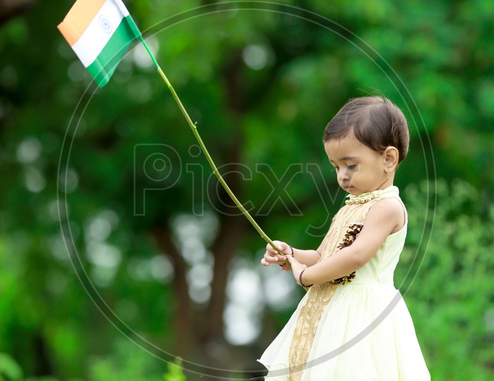 Indian Girl Child Holding Indian Flag
