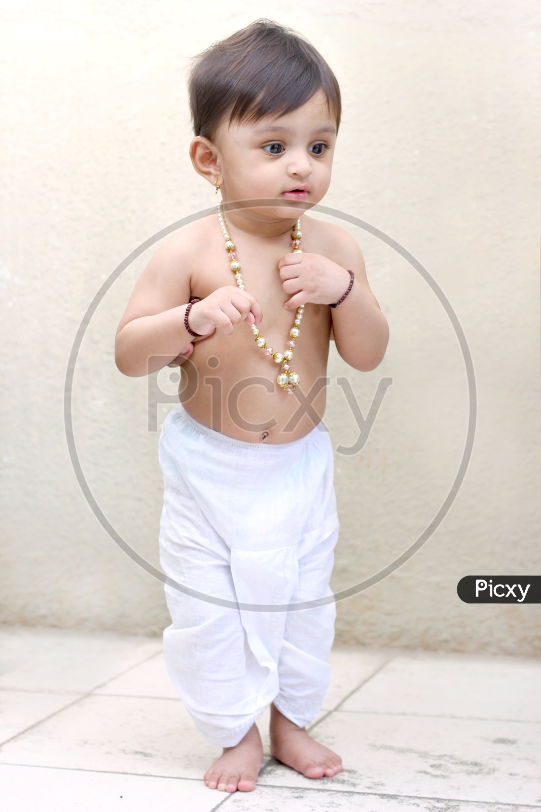 Baby girl dressed up like little lord Krishna
