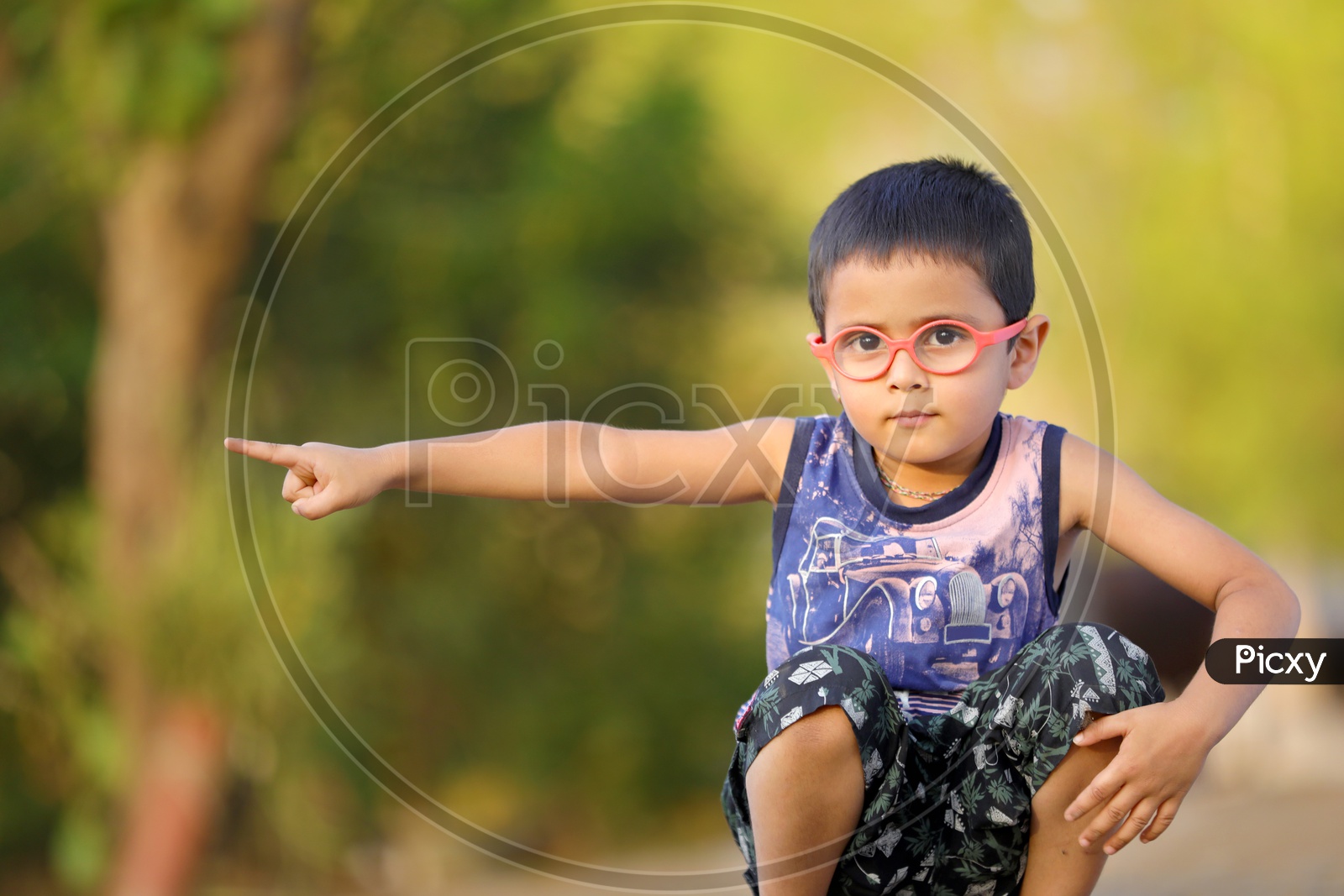 Indian Child on Eyeglass showing Hand