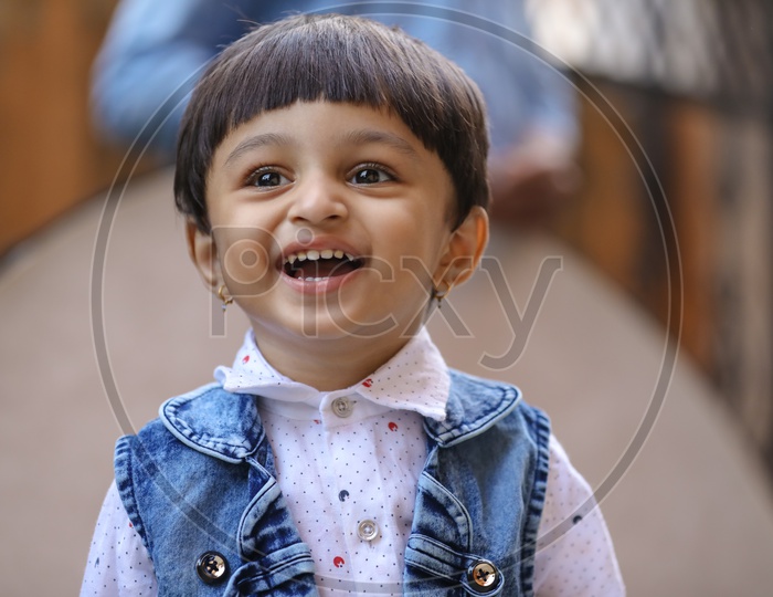 Smiling Indian Child or Indian Kid Playing