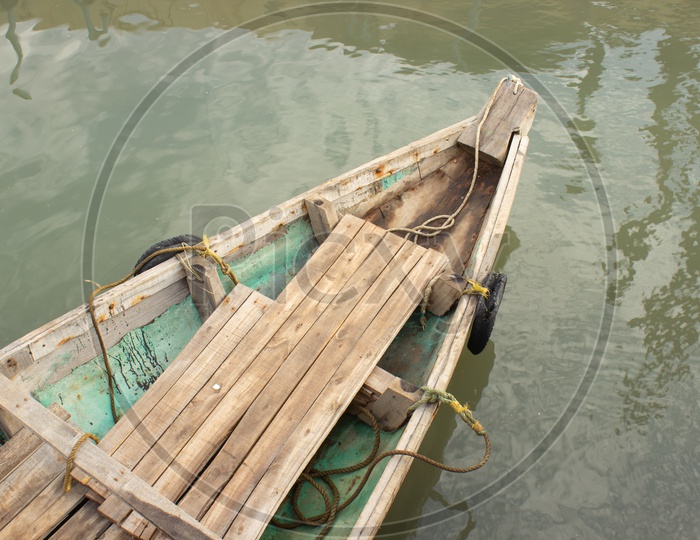 A Wooden Boat in Water  Closeup Shot