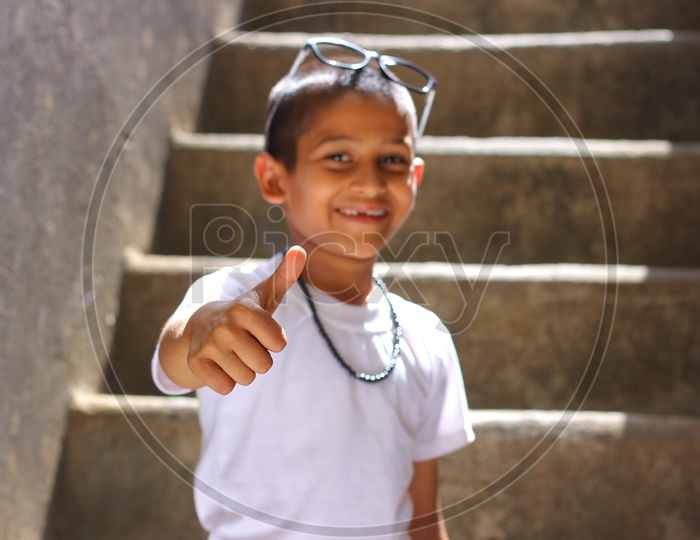 Indian Child showing Thump up or Indian Kid