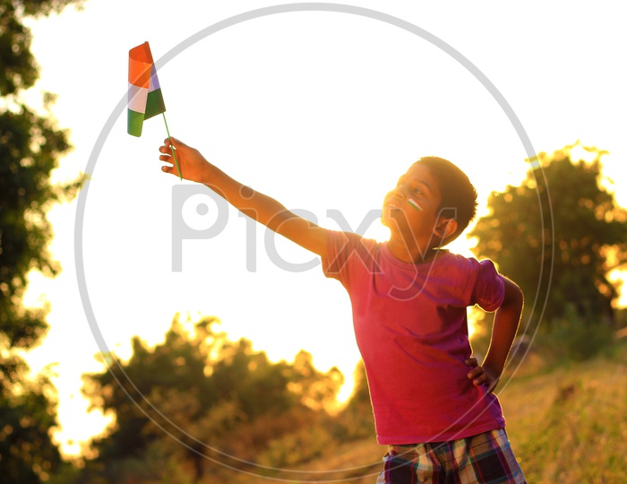 Indian Child Holding National Flag or Indian Kid
