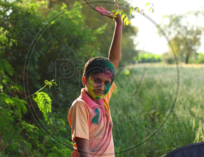 Rural Indian Child Celebrating Holi
