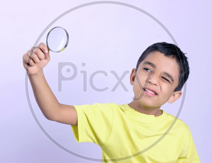 Indian Child Holding Magnifying Glass or Indian Kid
