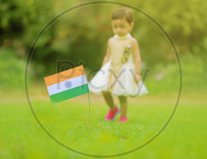 indian flag with kid in the background