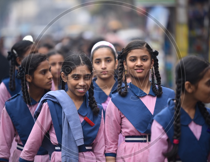 Indian School Girls in Their School  Uniform Walking Along a Street