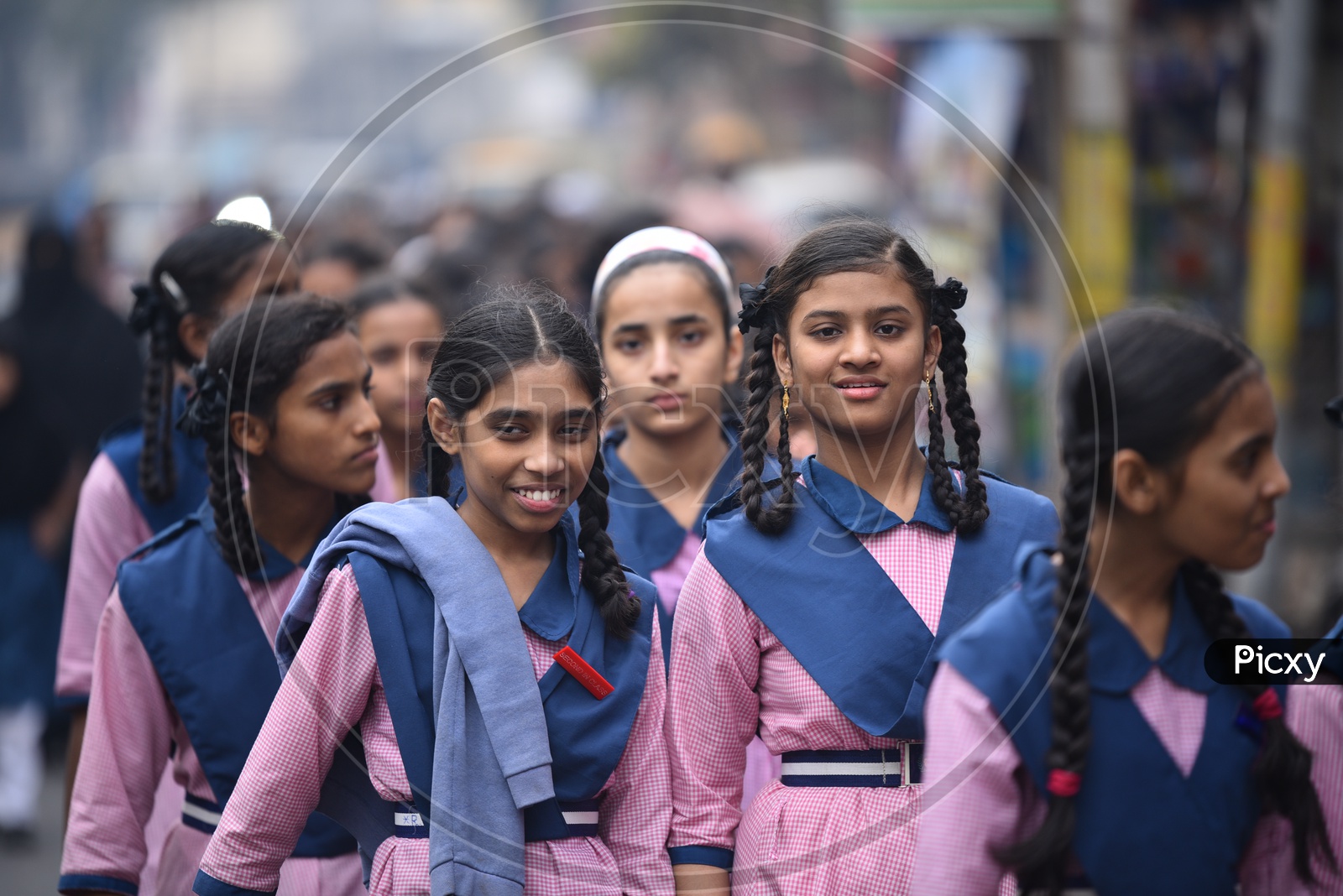 Indian School Girls in Their School  Uniform Walking Along a Street