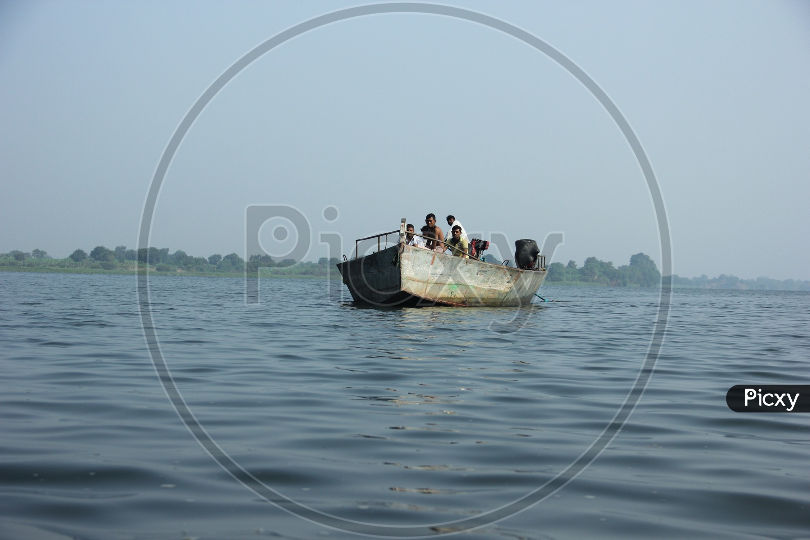 people traveling across the river in a boat