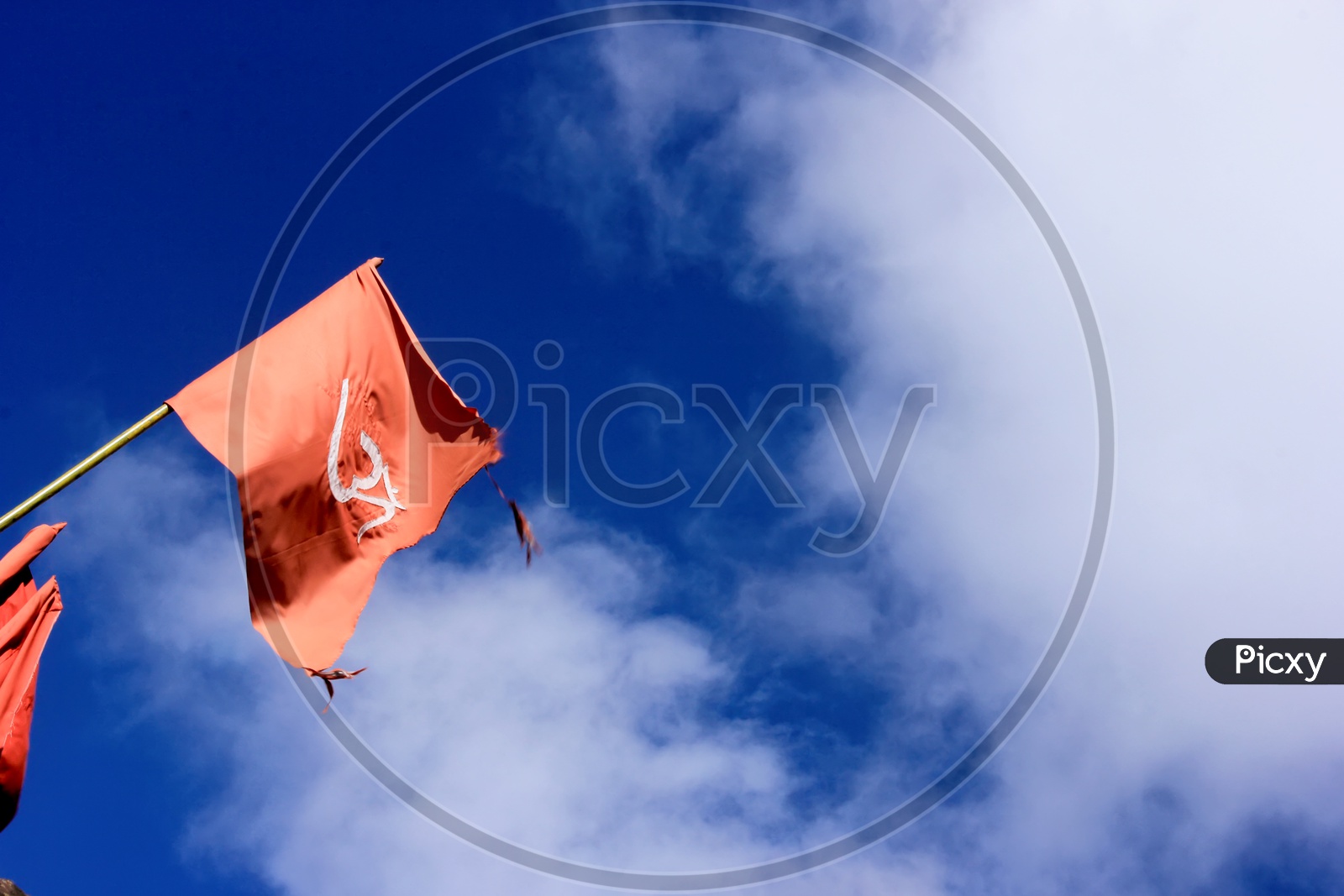 Red flag with a blue sky background