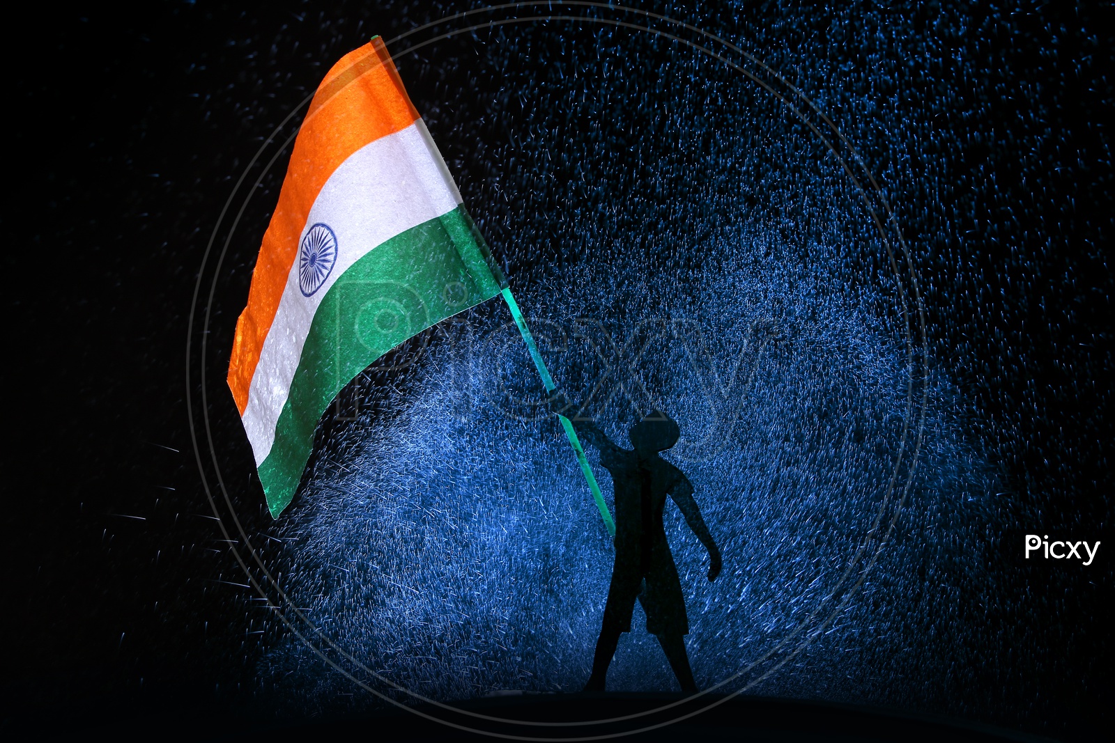 A kid holding Indian National flag with blue and black background