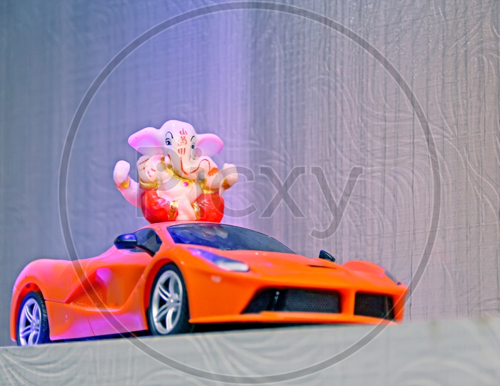 Lord Ganapathi or Ganesh Idol on Toy Car