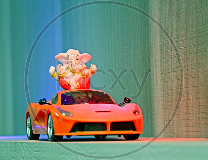 Lord Ganapathi or Ganesh Idol on Toy Car