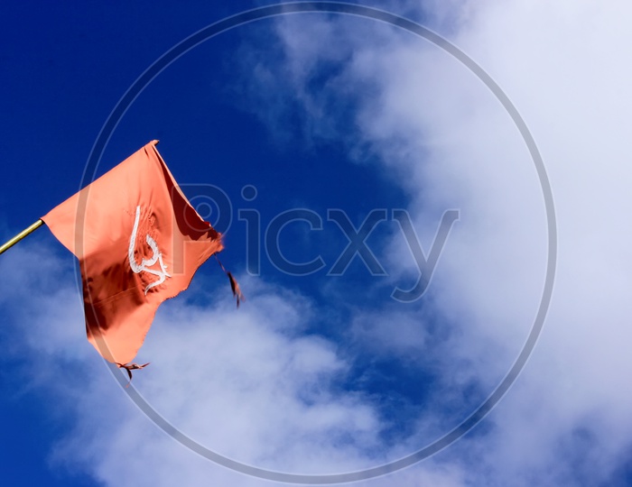 Red flag with a blue sky background