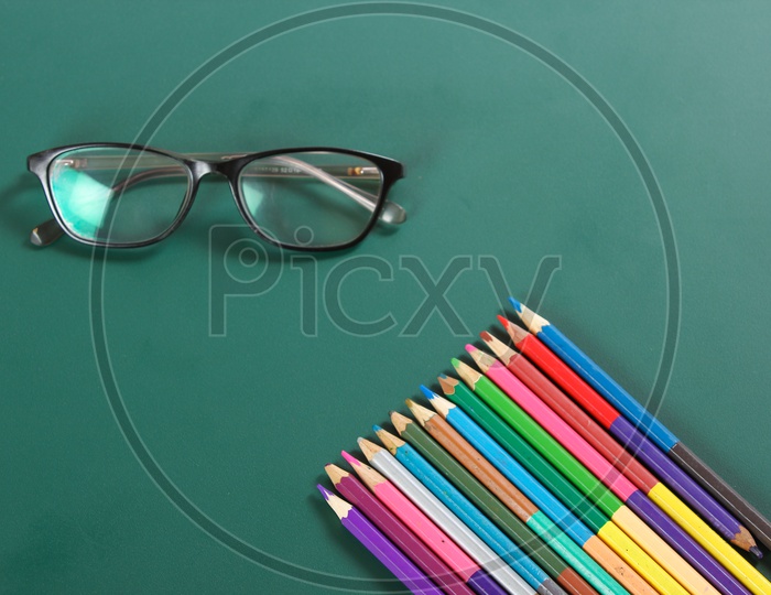 Happy Teacher Day Concept, Eye wears and Pencils