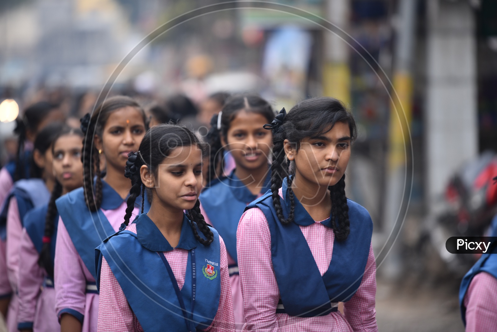 Girl students walking on road