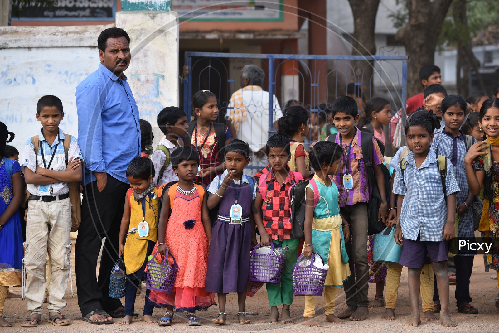 Indian School Children With Bags Waiting For Bus In Kosgi