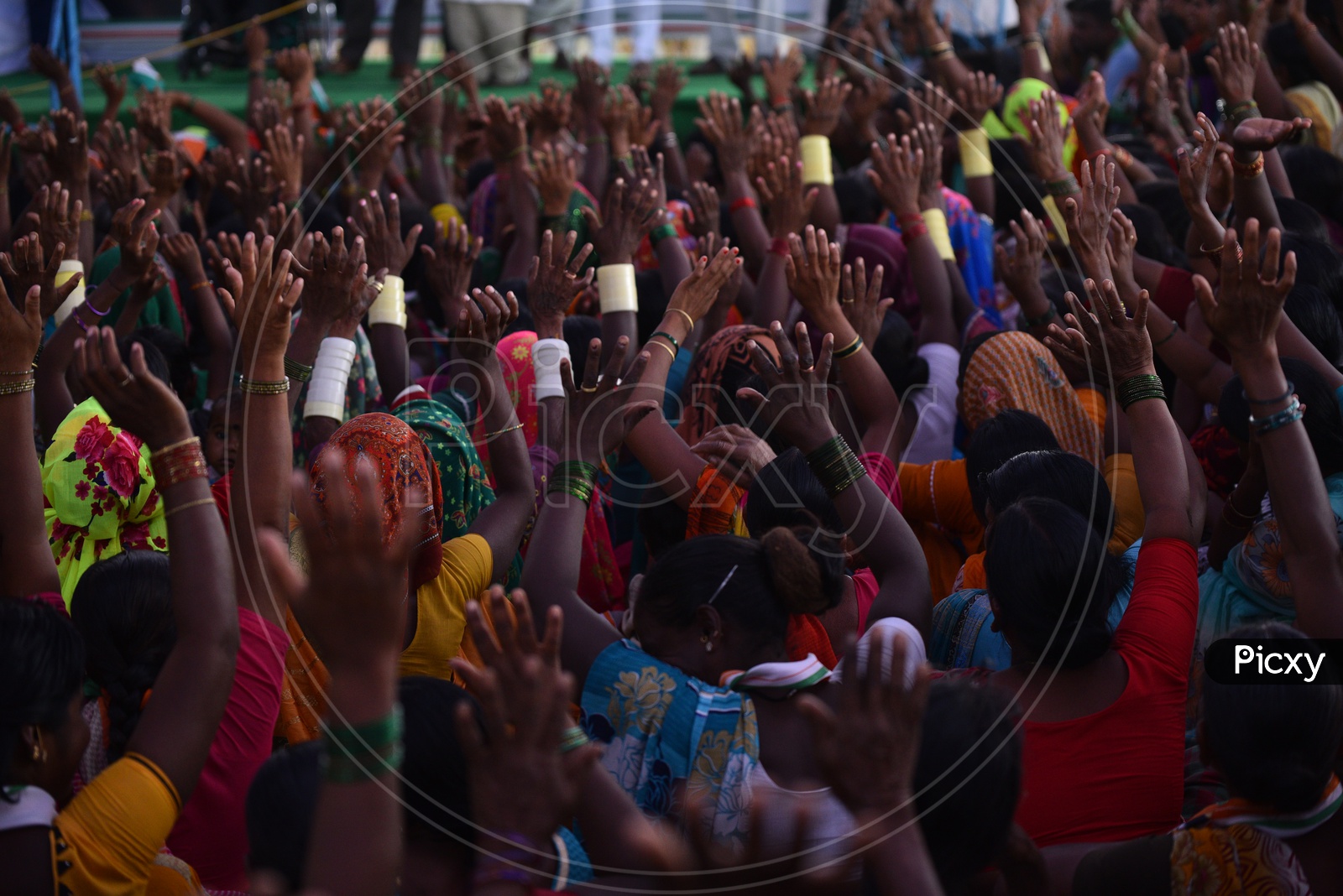 Lady Supporters Raising Thier Hands and Showing Support in a Road Show By Revanth Reddy