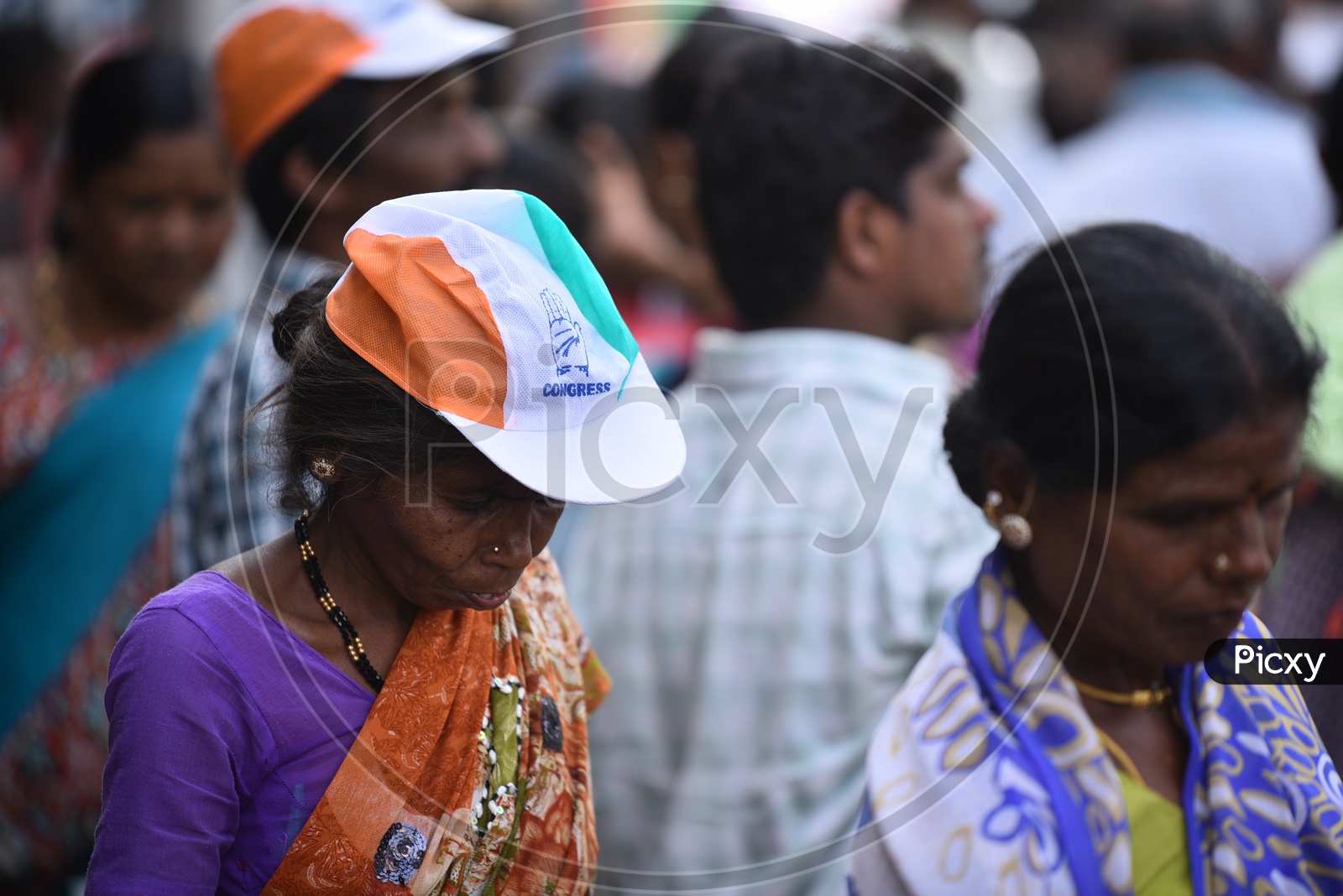 Indian Old Lady Spotted Wearing BJP  Party Caps in Election Campaign