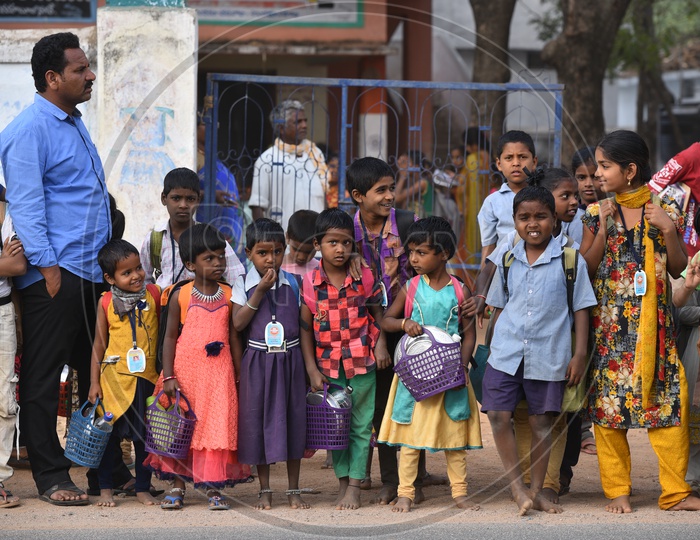 Indian School Children With Bags Waiting For Bus In Kosgi