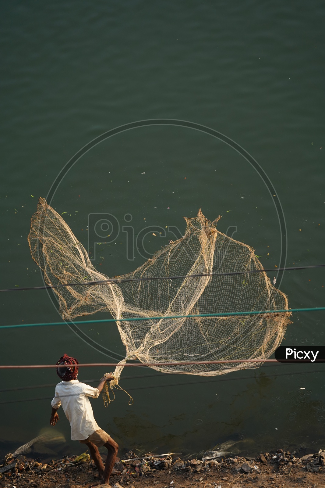 Fishing Net throwing by Fisherman